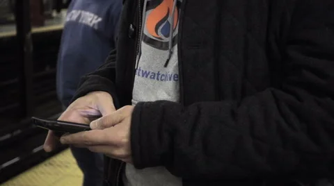 Close-up of man's hands on smartphone moving up to man's face, subway station HD Stock-Footage 59086742