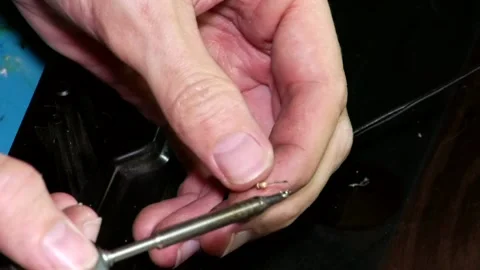 A close-up of a man's hands soldering computer wires with a hot soldering iron Video stock 346882167