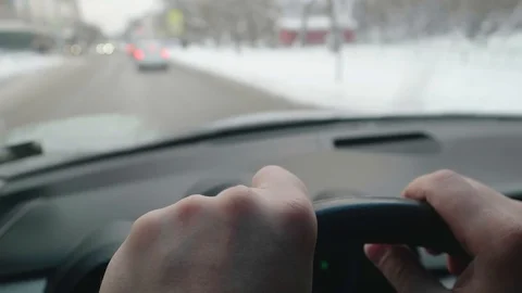 Close up of man's hands on steering wheel and blurred background with passengers Stock Footage 124573391