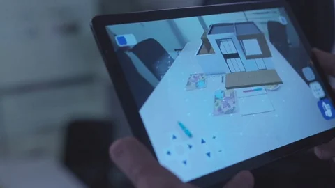 Close-up of man's hands with tablet looking at 3d design program. Stock. Work at Stock Footage 102783132