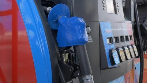 Close-up of man's hands taking nozzle from gas station pump. Stock Footage 100524190