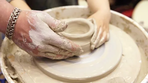 Close-up of man's hands, teach the child the art of pottery Stock Footage 64231154