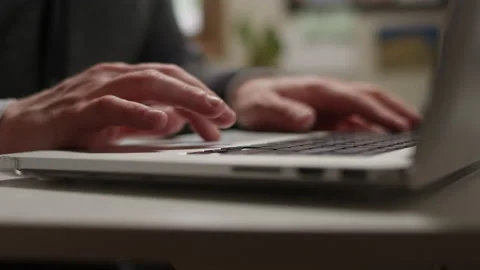 Close up of a man's hands typing and using the trackpad on a laptop Video stock 134269751