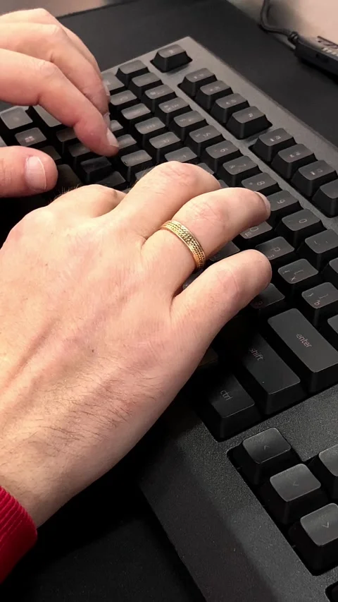 Close-up of a man’s hands typing on a computer keyboard Stock Footage 290043584