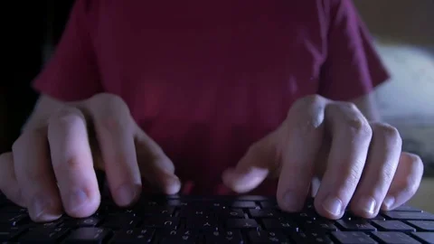 Close-up of man's hands typing on the keyboard in the night Stock-Footage 72540414