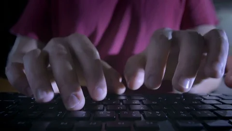 Close-up of man's hands typing on the keyboard in the night Stock Footage 72542340