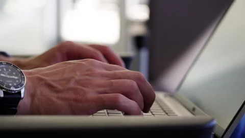 Close up man's hands typing on laptop computer Video stock 284808354