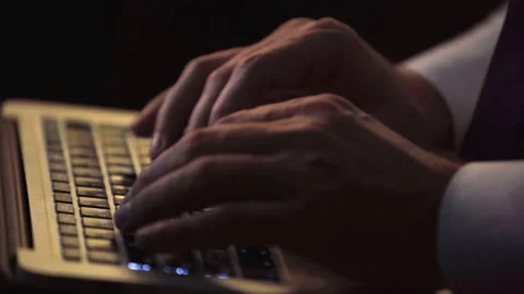 Close-up of a man's hands, typing on a modern laptop, writing a letter, a speech Stock Footage 235351674