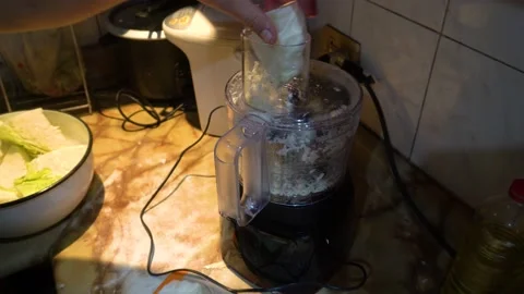 Close up man's hands using a food processor Stock Footage 146003411