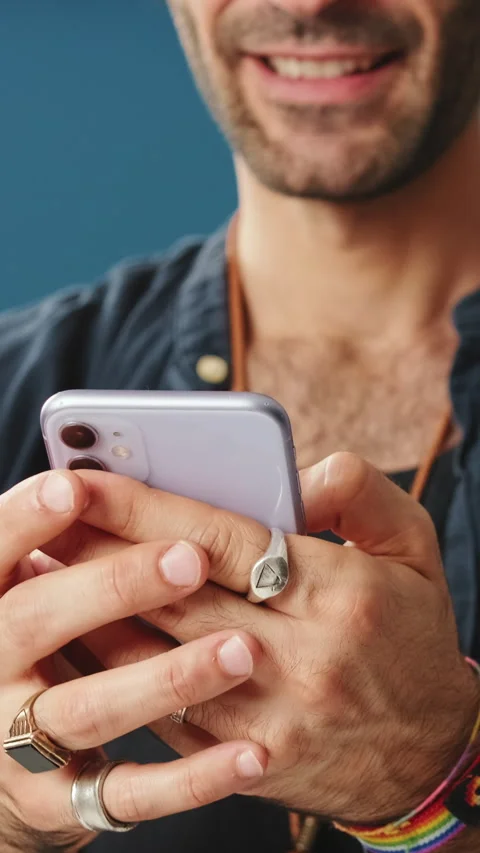 Close-up of man's hands using mobile phone, writing SMS, communicating on social Stock Footage 255962594