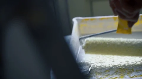 Close-up of mans hands using paint roller while working indoors Stock Footage 84824097
