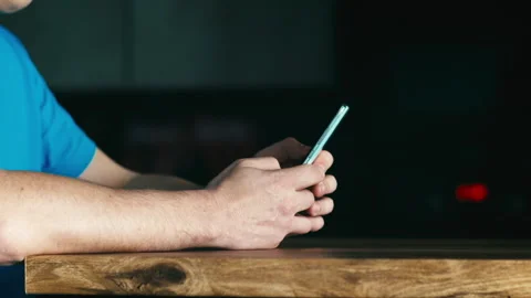 Close-up of a man's hands using a smartphone. A man browsing social media Stock Footage 307792984