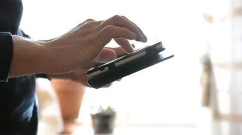 Close-up of man's hands using tablet at home Video stock 47061630