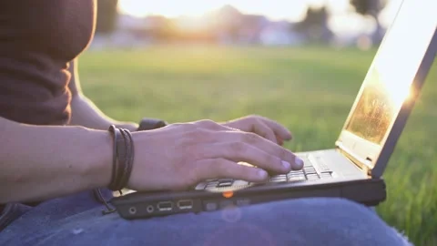 Close-up of man's hands working on laptop outdoors in city Stock Footage 136370169