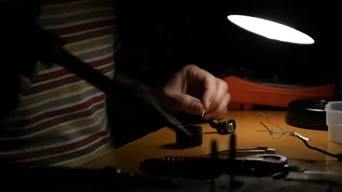 Close-up of a man's hands working with a soldering iron Video stock 148172440