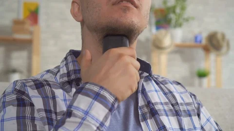 Close-up of the man's larynx which uses a voice assistant Stock Footage 114711954
