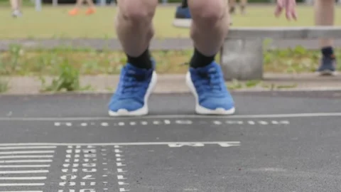Close-up of a man's legs during long jump Stock Footage 161017871