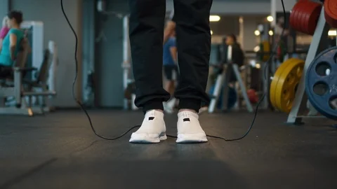 Close-up of man's legs jumping rope Stock Footage 101024018