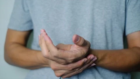 Close-up of a man's painful hand Stock Footage 290869545