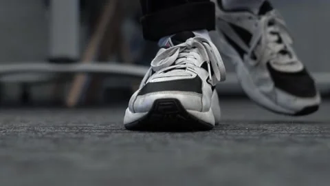 Close-up Of A Mans Shoes Walking By A Camera Indoors Stock Footage 130676787