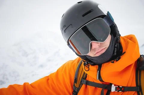 Close-up of a man's ski goggles looking straight into the camera. Portrait of a Stock Photos