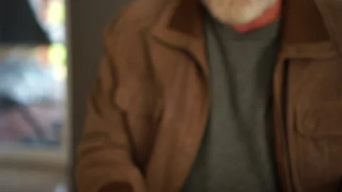 Close-up of a mansface and hands counting money savings due to economic Stock Footage 142228161