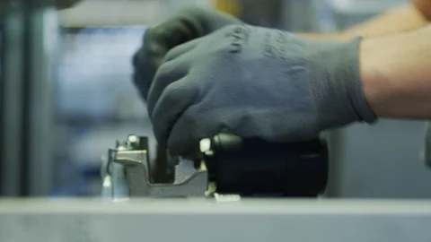 Close up on manual assembling in Automated Mass Production Plant - Automation Stock Footage 98692292