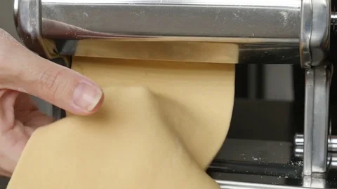 Close-up of manual pasta machine using at home Stock Footage