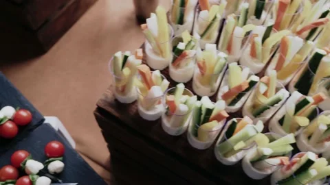 Close-up of many canapes set on a table. Finger sandwiches on a buffet dinner or Stock Footage 171885512