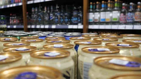 Close-up of many cans with alcohol beverage in alcohol department Stock Footage 294081262