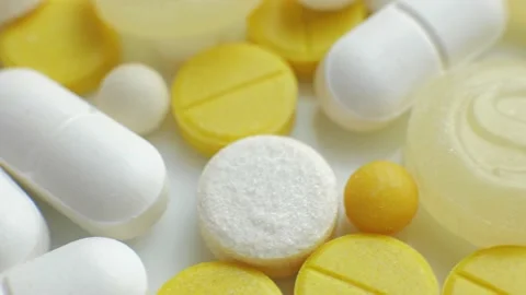 Close up of many different rotating pills Stock Footage 205415268