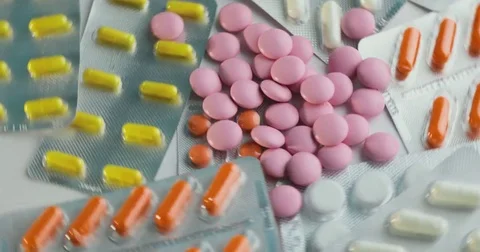 Close up of many different spinning Pills and drugs. Medicine, pills and tablets Stock Footage 78546298