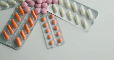 Close up of many different spinning Pills and drugs. Medicine, pills and tablets Stock Footage 78547831