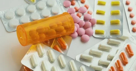 Close-up of many different turning pills. Packaging of tablets and pills on the Stock Footage 78541115