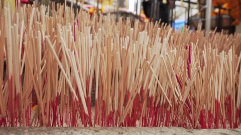 Close up of many no lit incense sticks in the courtyard of the Buddhist temple Stock Footage 289458769