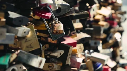 Close up of many padlocks that couples attached to the bridge to symbolize love. Stock Footage 330240887