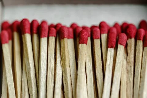 Close-up of many red face matches in the box on a white background Stock Photos
