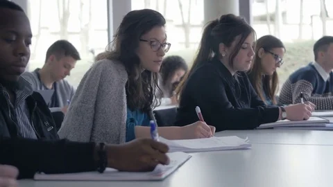 Close-up of many students participating in a lecture and taking notes 스톡 동영상 69932099