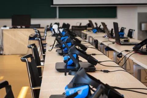 Close up of many virtual reality (VR) sets  in a classroom - headset, controller Stock Photos