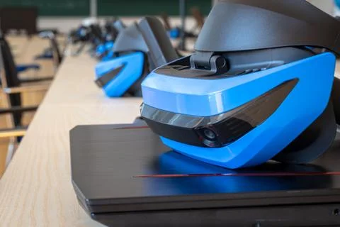 Close up of many virtual reality (VR) sets  in a classroom - headset, controller Stock Photos