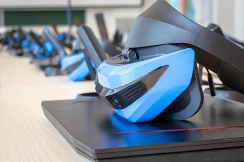 Close up of many virtual reality (VR) sets  in a classroom - headset, controller Stock Photos