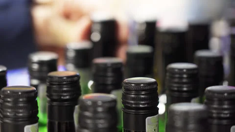 Close-up of many wine bottles on a store shelf Stock Footage 220568397