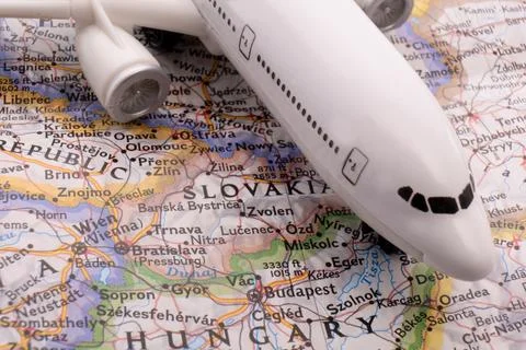 Close up of map with miniature plane highlighting Budapest, Hungary through Foto stock