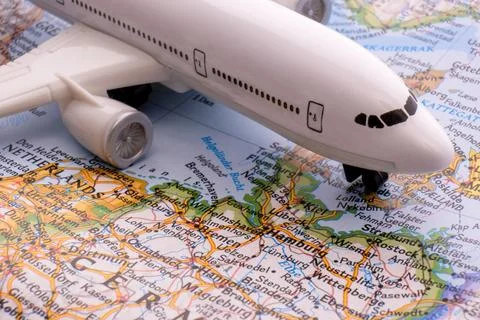 Close up of map with miniature plane highlighting Hamburg, Germany through 库存照片