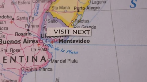Close up map of South America with Visit Next paper sticker note Stock Footage 346576756