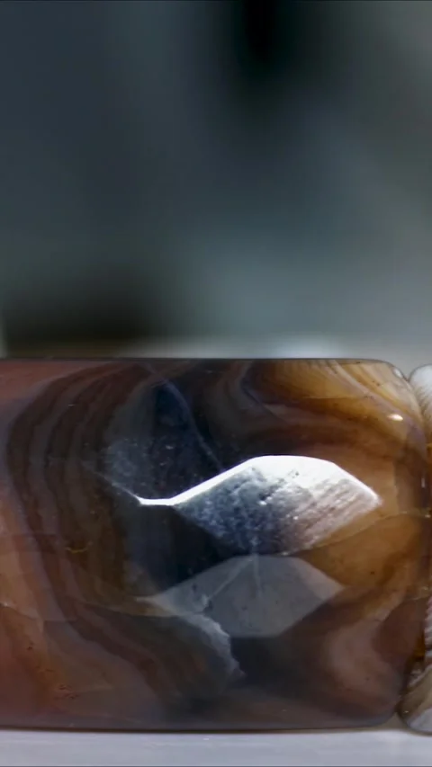 Close-up of a marble bracelet lying on a table. Stock Footage 345168818