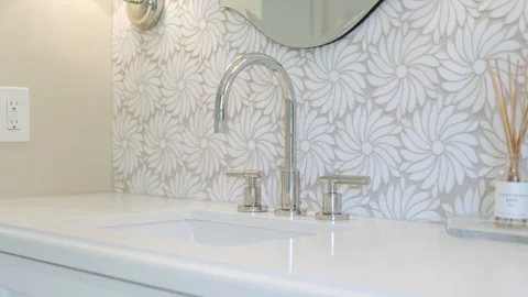 Close up of marble counter with clean wash basin and modern style faucet. White Stock Footage 242943746