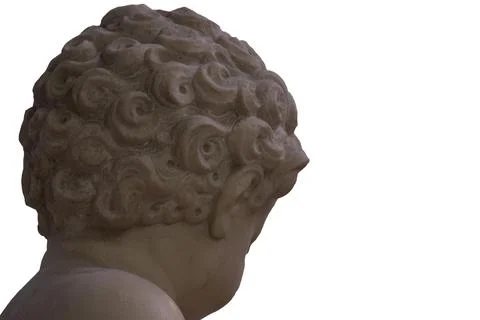 Close up of marble statue back of head of small child, cherub showing curly hair 库存照片