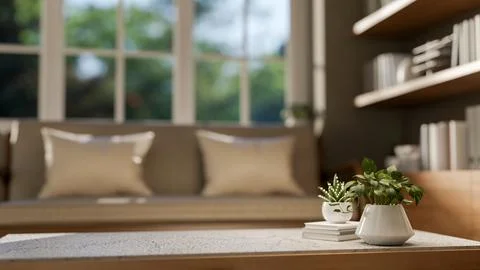 Close up marble table with books and potted plants across sofa and shelf in.. Stock Illustration