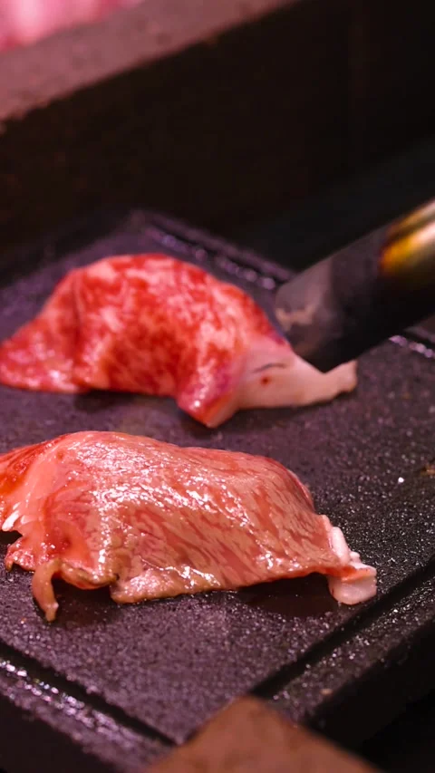 Close Up of Marbled Beef Searing with Blowtorch on Hot Stone Stock Footage 326026551